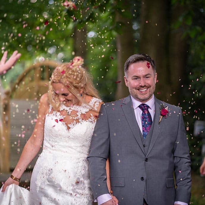 K&P wedding couple wtih confetti on their wedding day - Camellio Wedding Planning and Events - Essex Wedding Planner