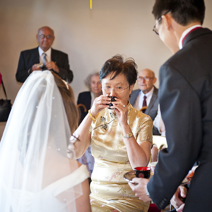 Multicultural Wedding Chinese and English Tea Ceremony Family Kneeling - Camellio Wedding Planning and Events - Essex Wedding Planner