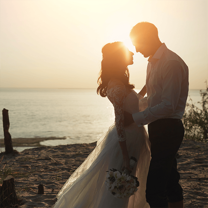 Beach Wedding couple kissing and in love - Camellio Wedding Planning and Events - Essex Wedding Planner