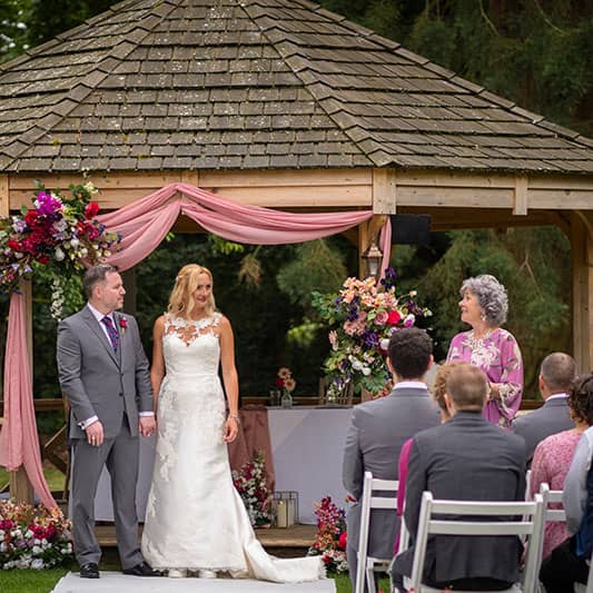 Weddings by Ruth marrying couple K and P outside at Mullbery House - Camellio Wedding Planning and Events - Essex Wedding Planner