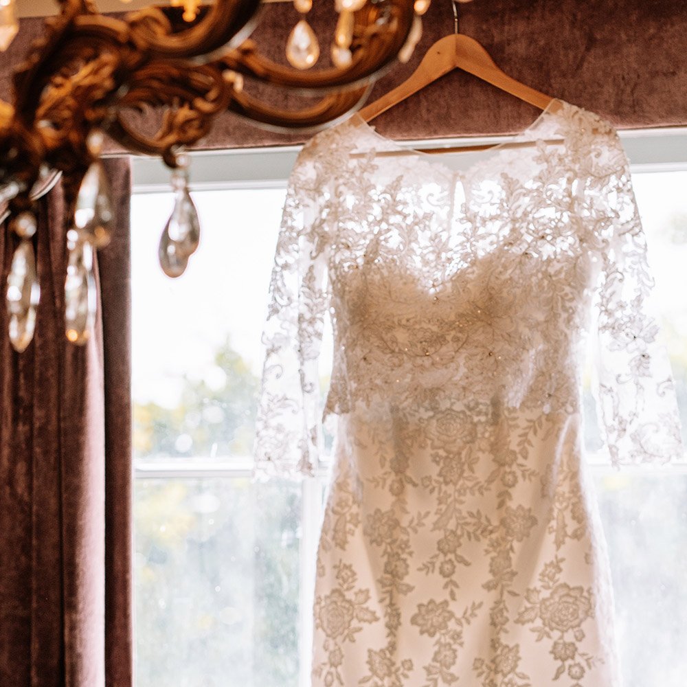 Lace wedding dress on hanger