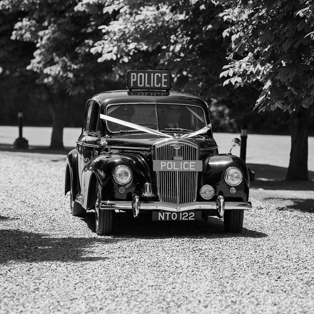 Arriving in style, Vintage police car used as wedding car